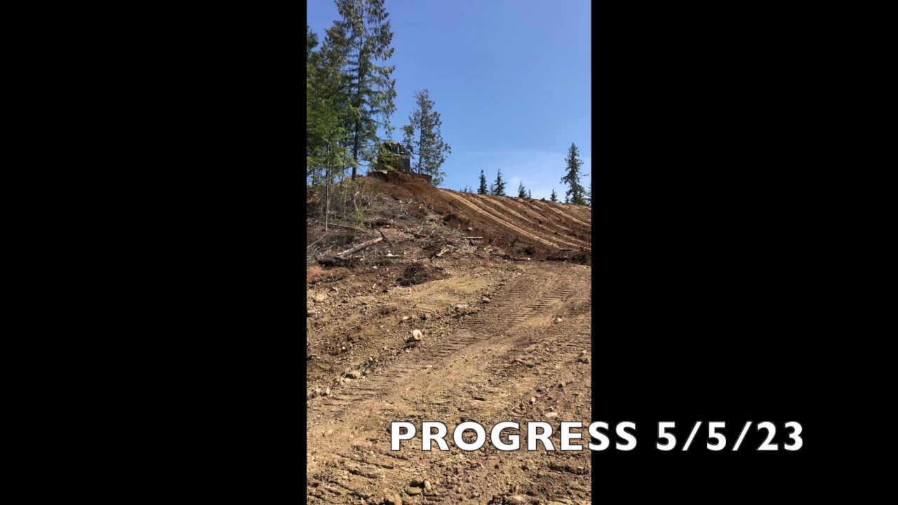 Bulldozer working steep grade — Clark Fork hillside