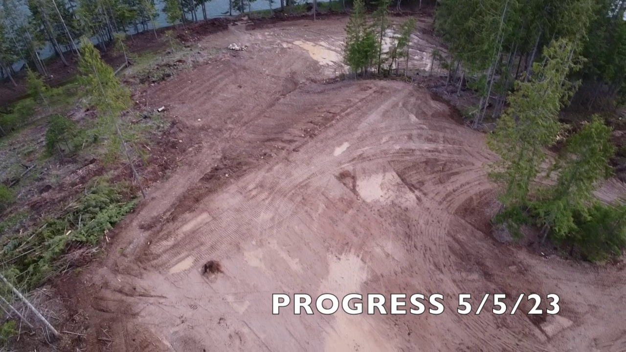 Cleared building pad by Clark Fork River — aerial