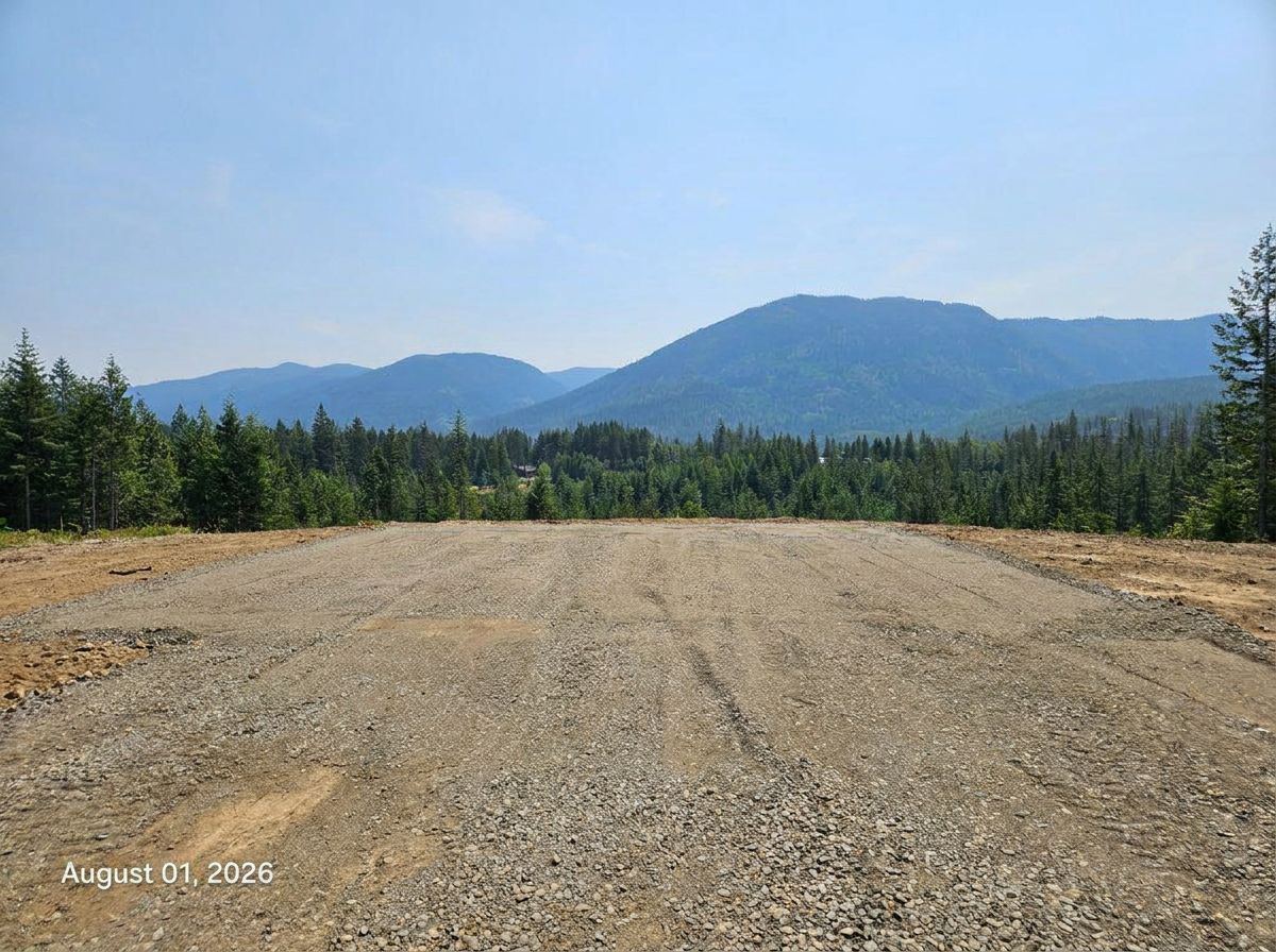 After — cleared building pad with mountain view